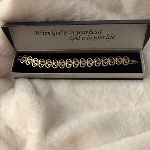 Marked SJ  Jewelry, Two-tone Bracelet with Interlocking Design. “GOD”